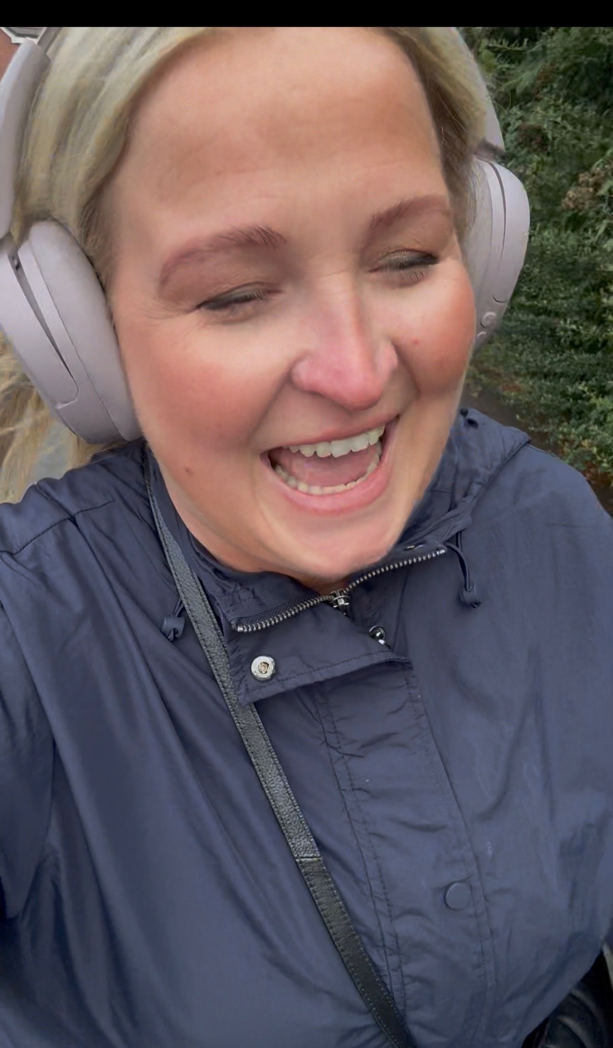 Natalie laughing outside during a walk